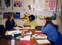 Ms. Daniel discusses projects with students