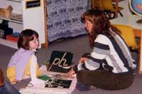 A student interacting with a kid